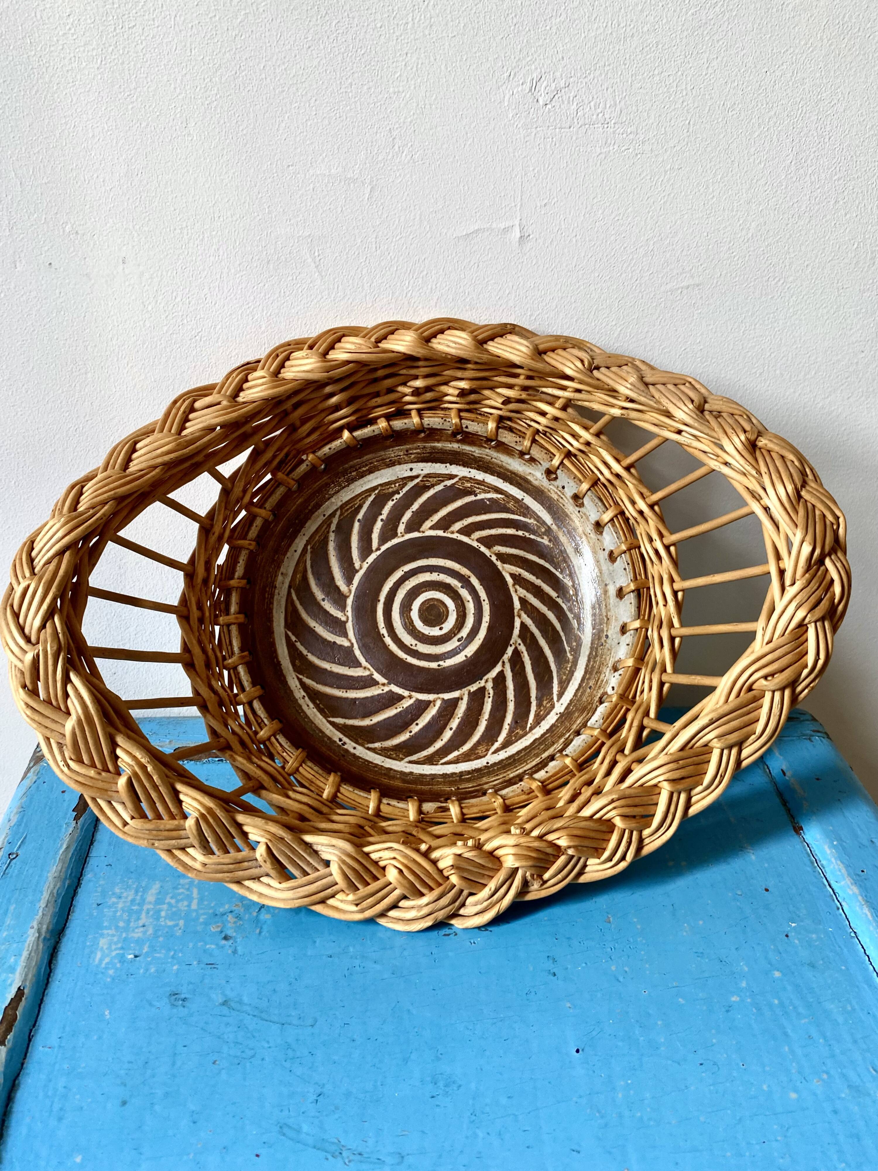 Wicker and ceramic piece signed, 1990s.