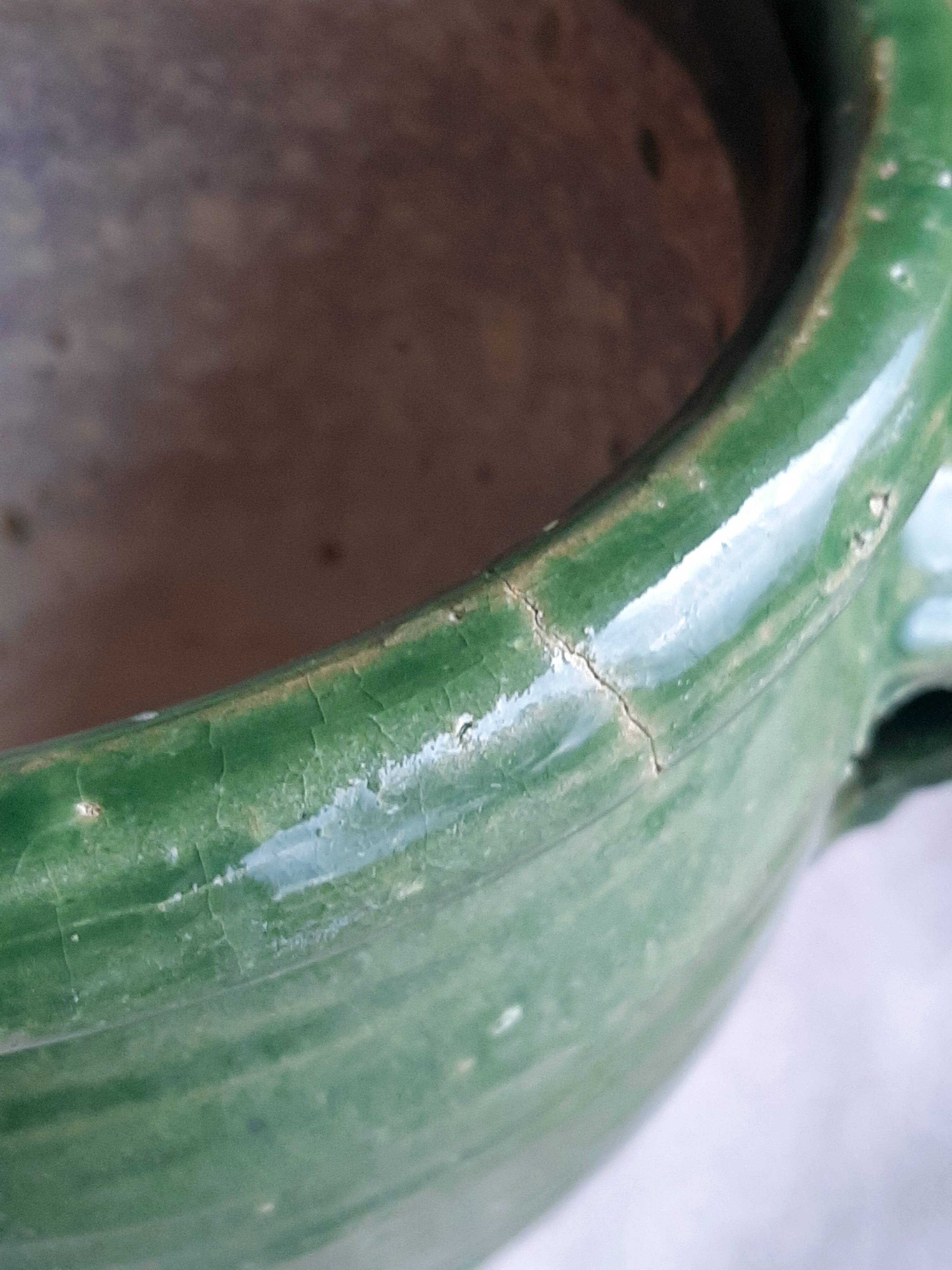 Glazed green terracotta pot.