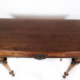 Antique game table with extention, of mahogany and walnut, 1860s
