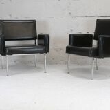 Pair of stainless steel, black leather-like armchairs, France, circa 1970