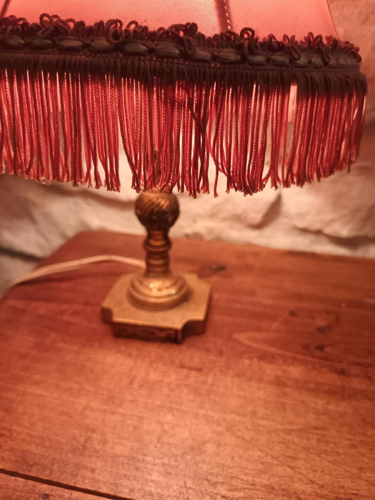 Vintage lamp, pink fringed pagoda shade and brass base.