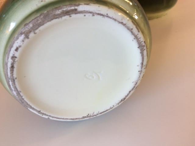 Pair of enamelled sandstone vases