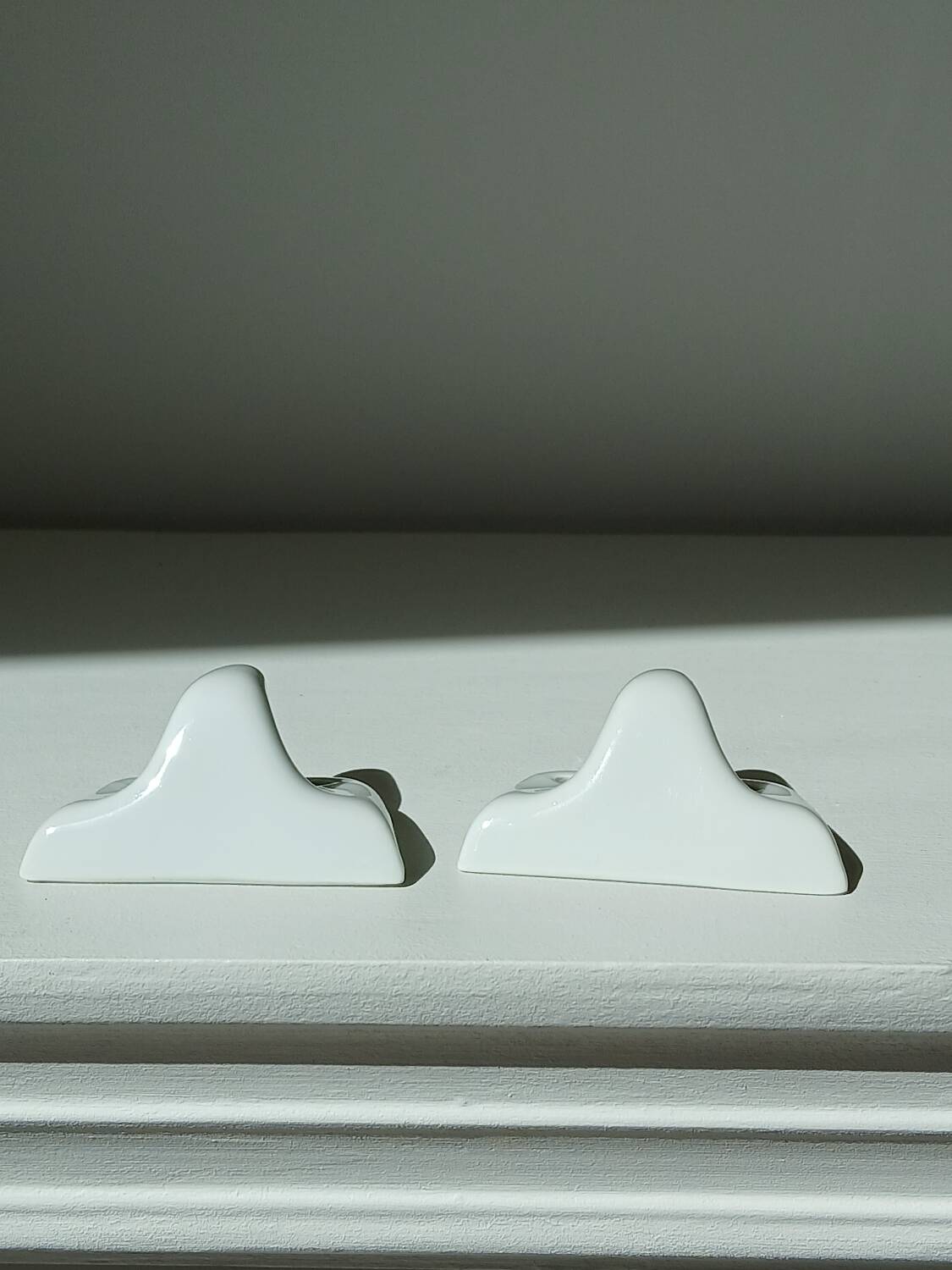 Set of two porcelain tea towel holders