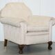 Victorian suite in damask, walnut frame, legs carved in lion's paw.