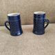 Two vintage mugs in traditional German earthenware.