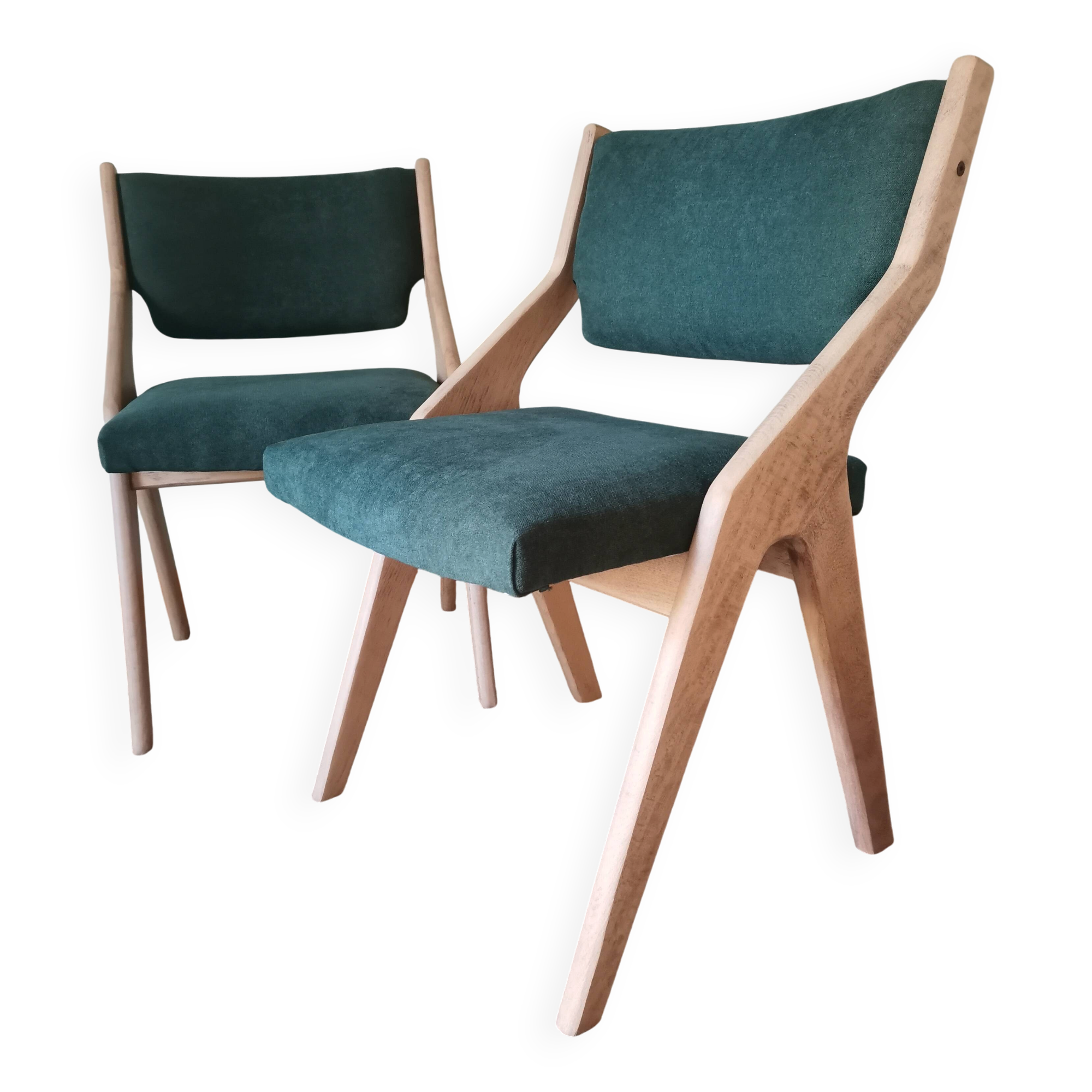Scandinavian green chairs with tapered legs.