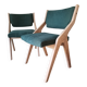 Scandinavian green chairs with tapered legs.