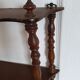 Turned wooden wall shelf
