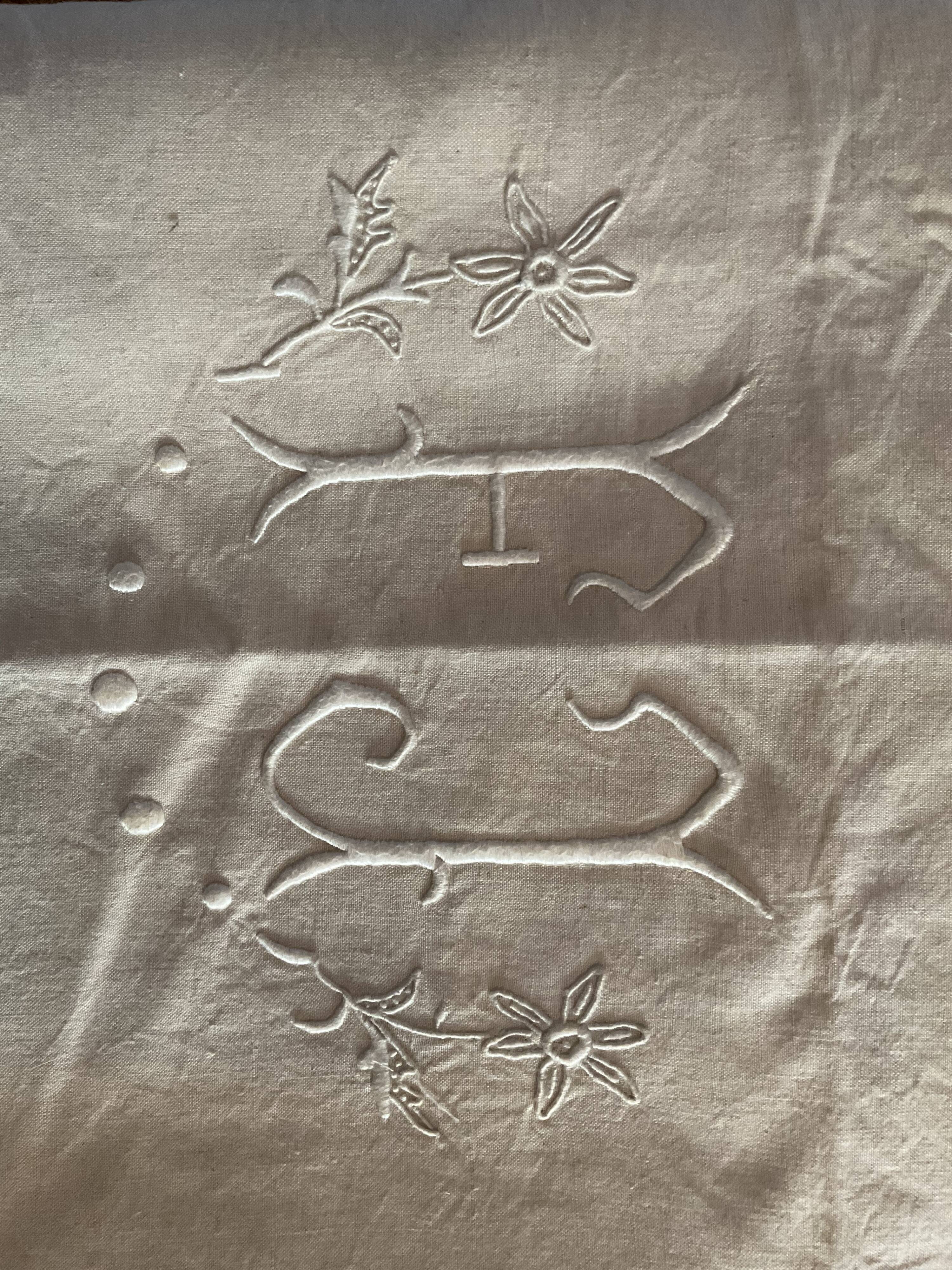 Old embroidered sheet, monogram F J
