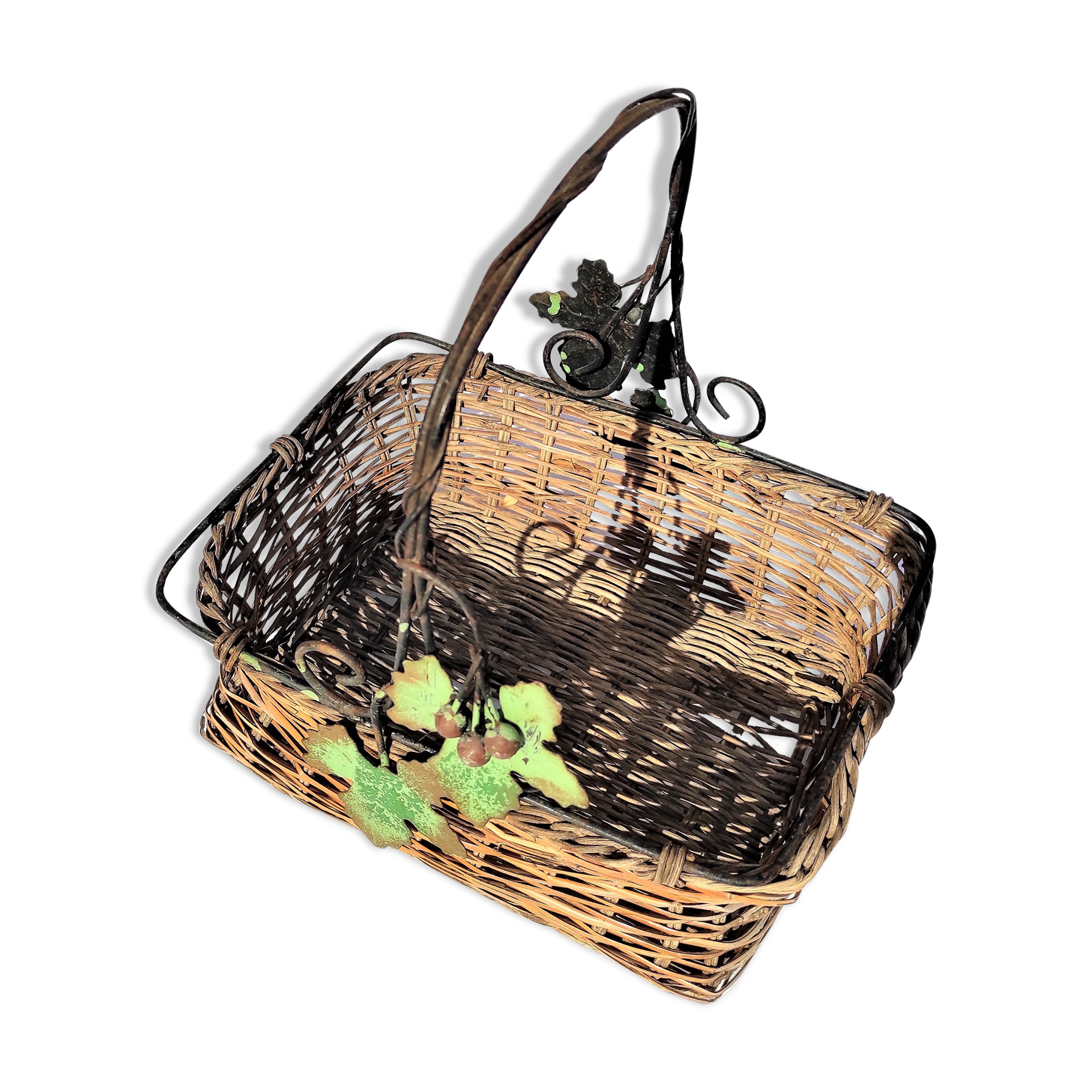 Old wicker basket decoration vine leaves and grapes