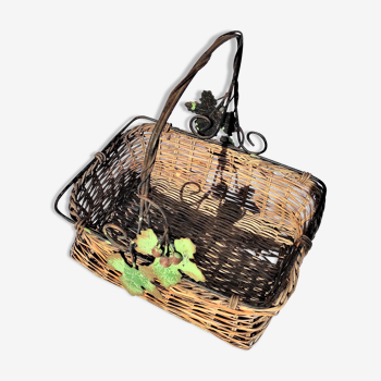 Old wicker basket decoration vine leaves and grapes