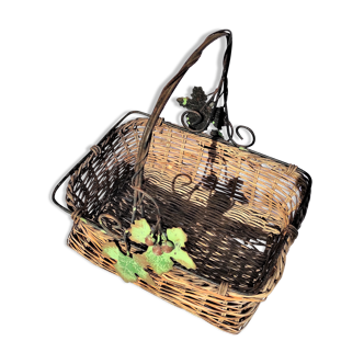 Old wicker basket decoration vine leaves and grapes