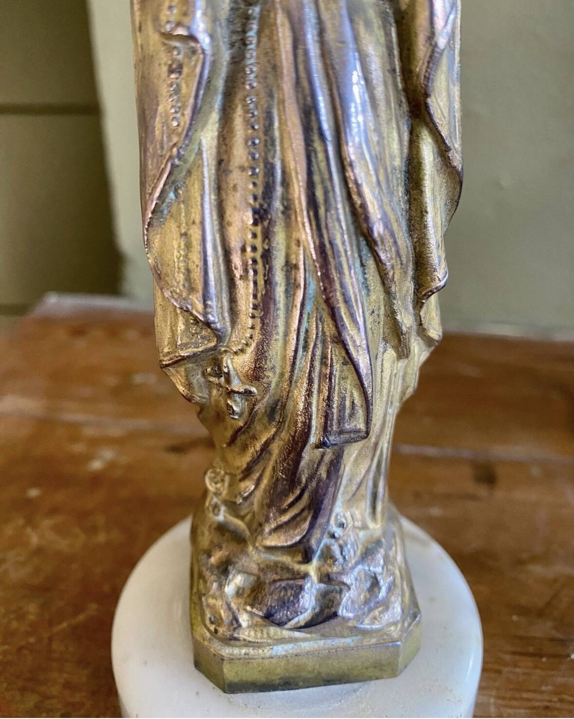 Virgin Mary crowned in metal and brass