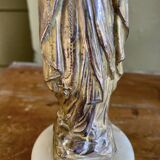 Virgin Mary crowned in metal and brass