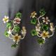 Pair of vintage painted sheet metal wall lights with flowers and foliage decor