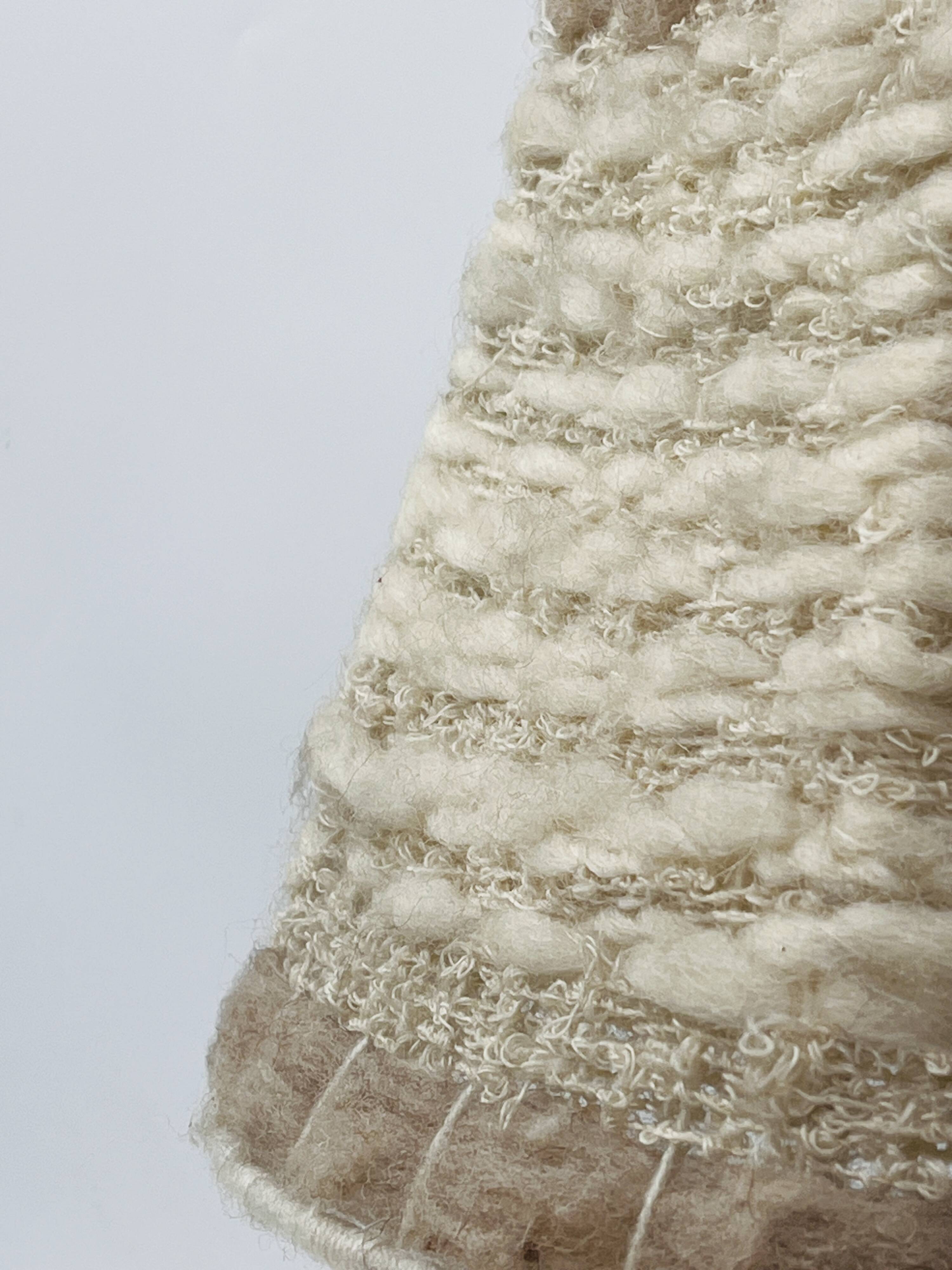 Vintage ceramic lamp with relief and wool shade.