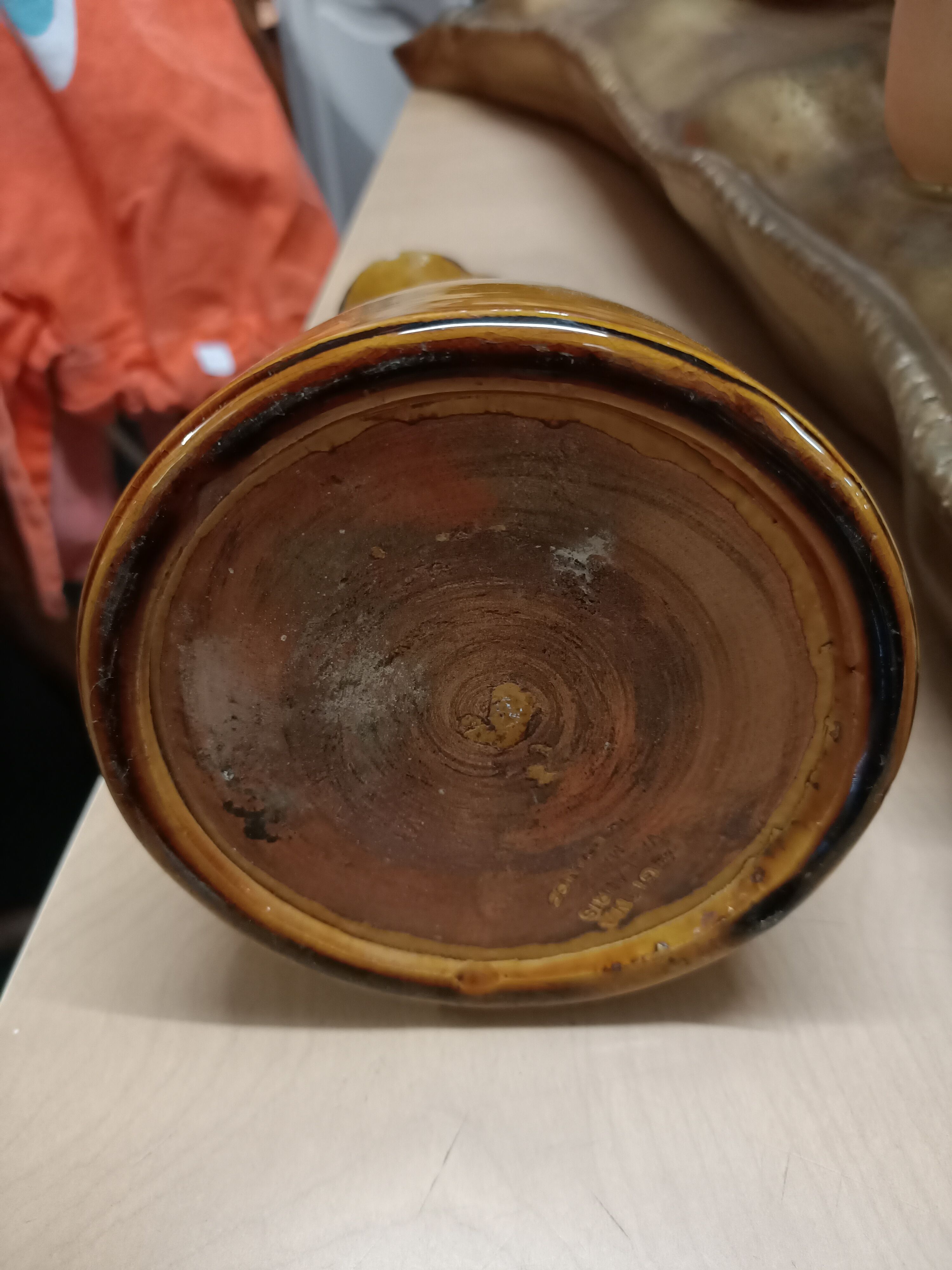 Enamelled terracotta jug