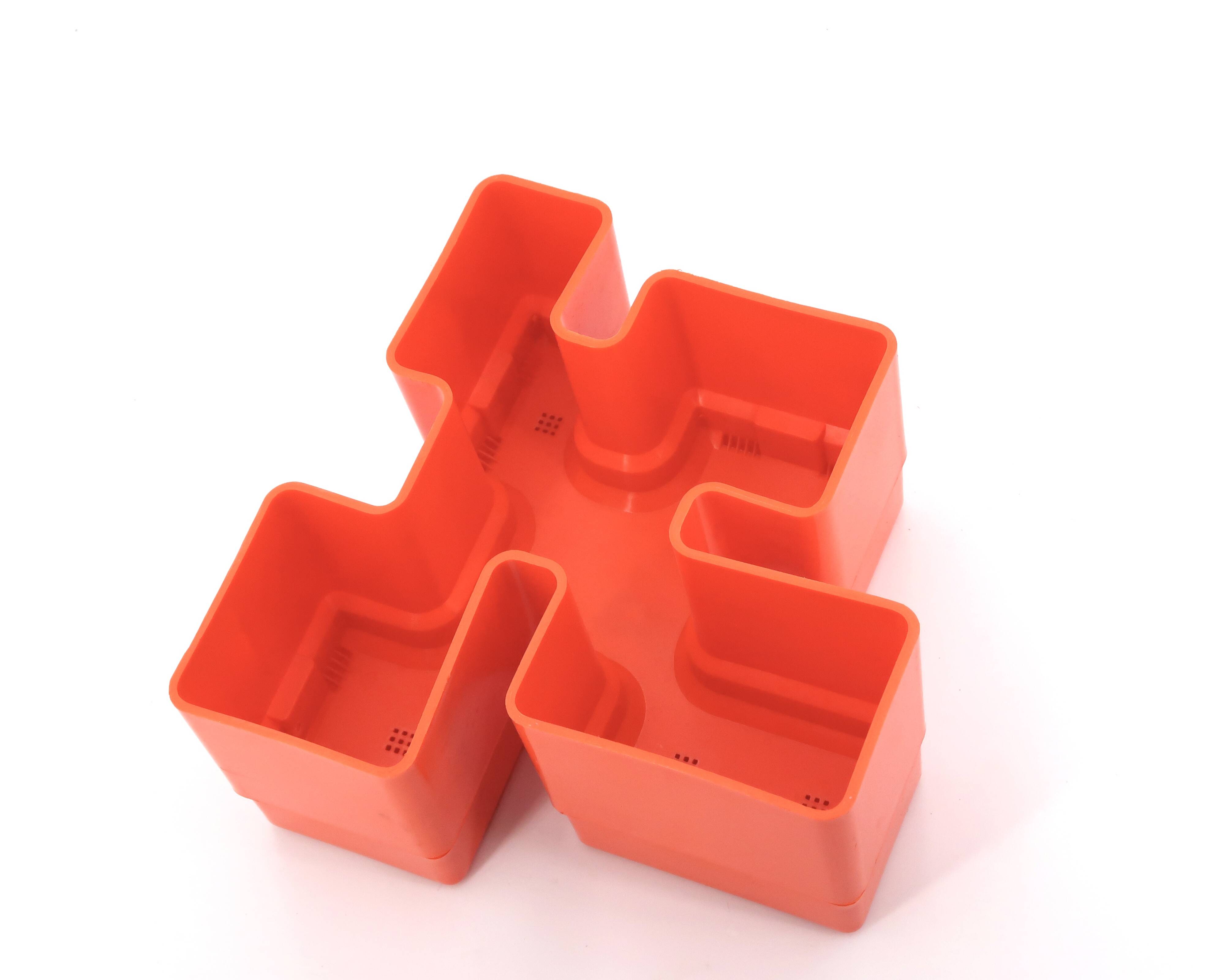 Vastill orange plastic planter by Michael McCann