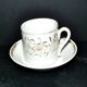 Paris porcelain coffee cup with floral design, antique porcelain with gold trim.