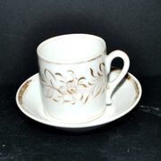 Paris porcelain coffee cup with floral design, antique porcelain with gold trim.