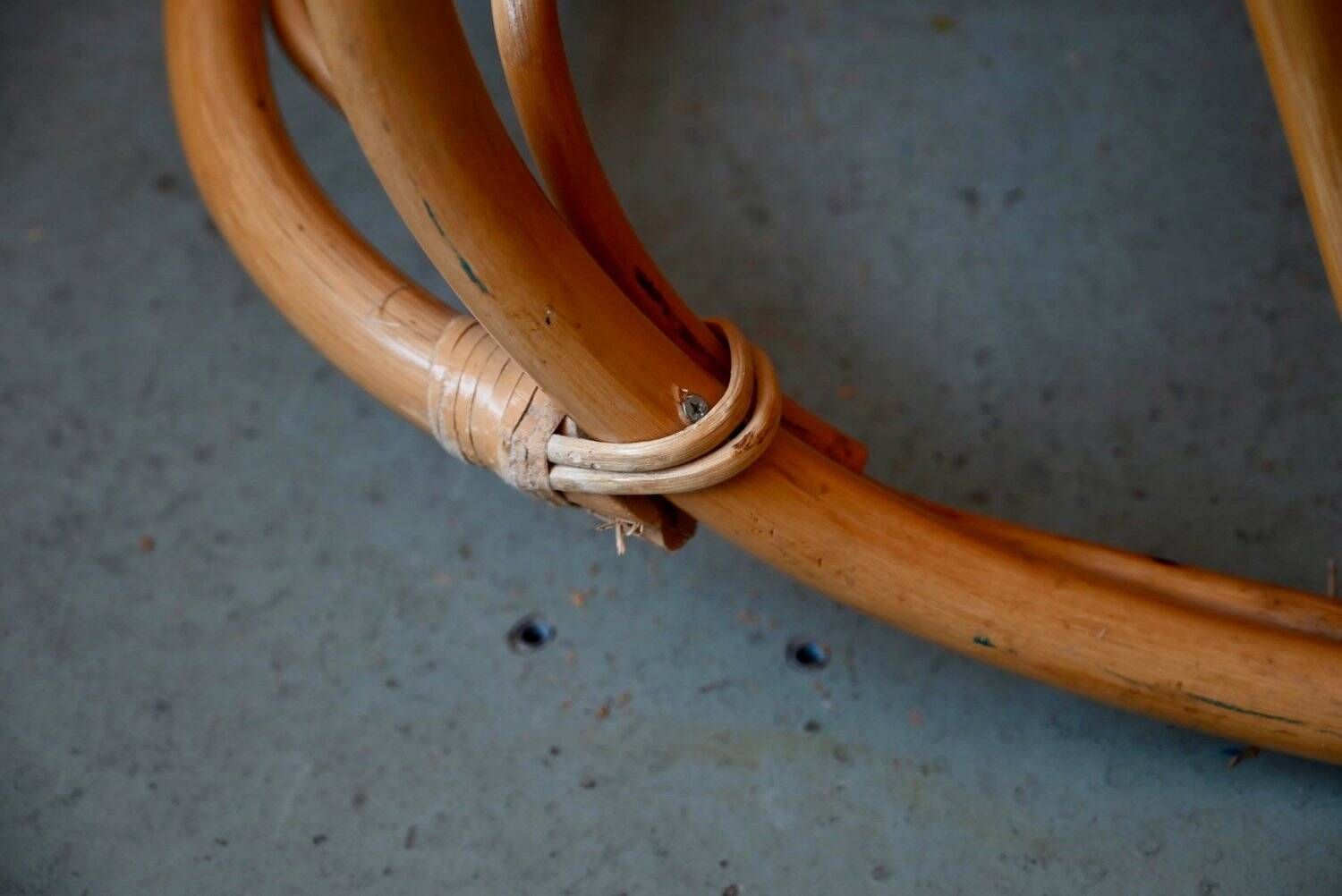 Vintage rocking chair in rattan from the 60s-70s, high openwork backrest.