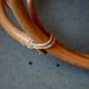 Vintage rocking chair in rattan from the 60s-70s, high openwork backrest.