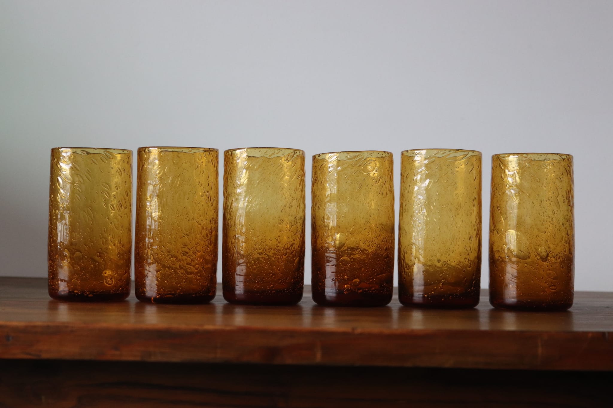 Set of 6 amber, blown and bubbled Biot glasses