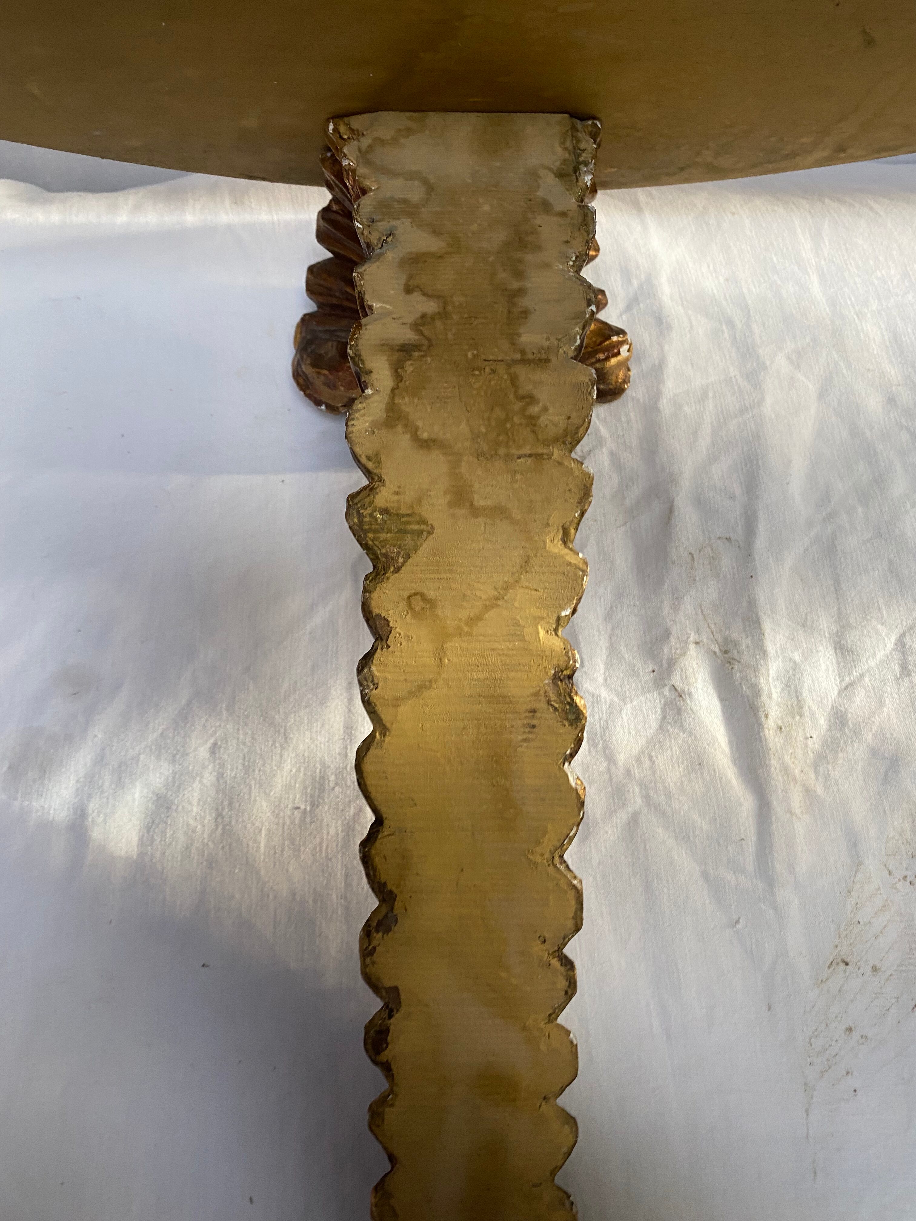 Wooden wall console and antique gilded stucco