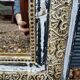 Antique mirror with carved wooden frame