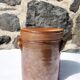 Trio of stoneware pots with lids