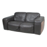 Two-seater sofa made of coarsely grained thick leather.