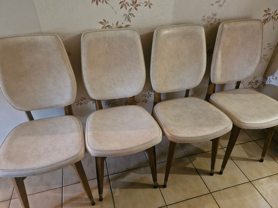 4 solid wood chairs with beige faux leather.