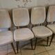 4 solid wood chairs with beige faux leather.