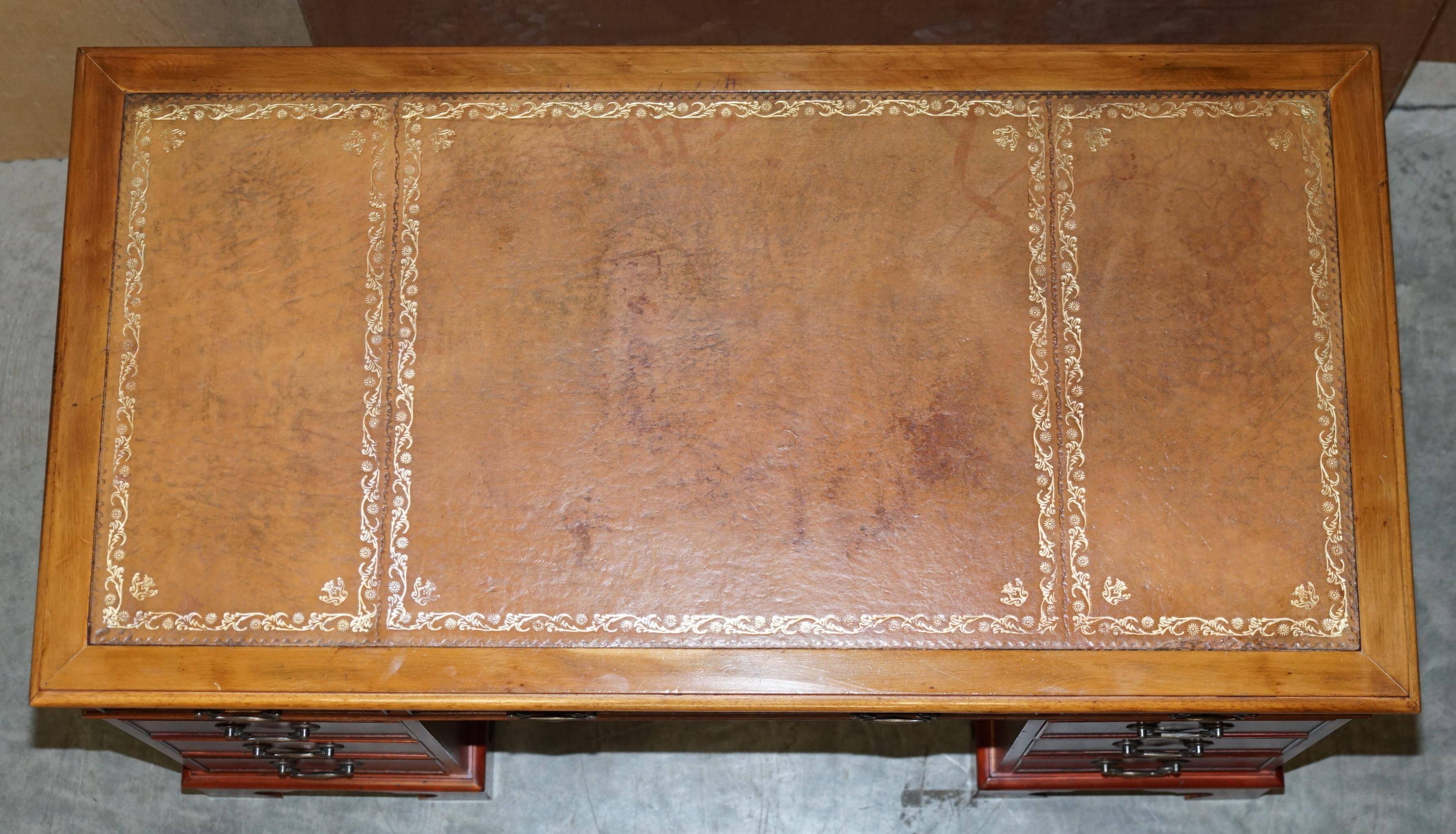 Vintage walnut desk with a leather top and two drawers.