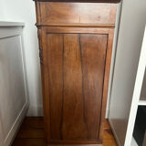 Solid wood storage furniture with a marble top.