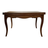 Extendable dining table in Louis XV style made of wood.