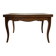Extendable dining table in Louis XV style made of wood.