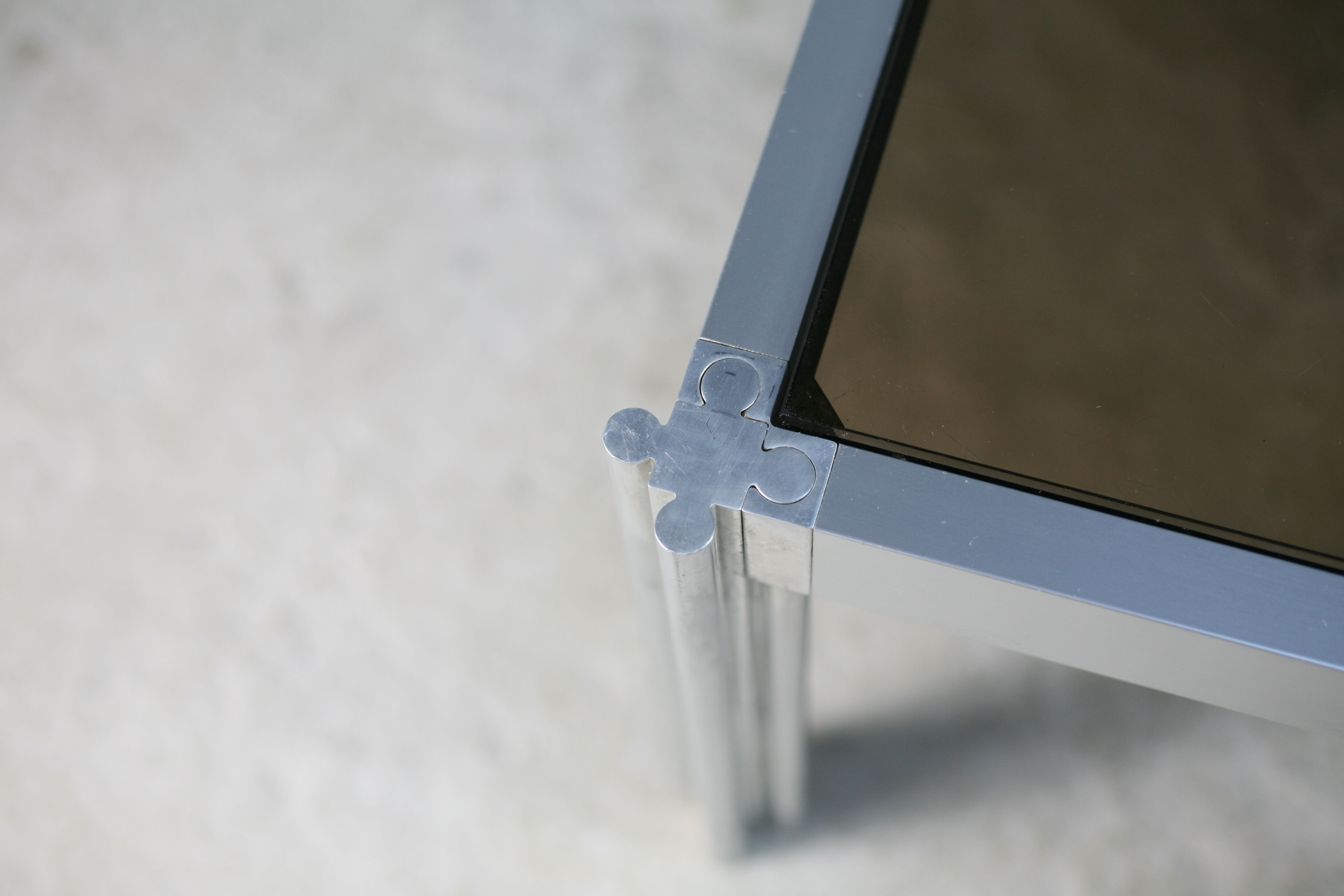 International Furniture. Steel coffee table and smoked glass. Circa 1970