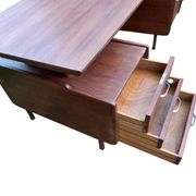 Vintage 1950s teak desk by designer Jacques Hauville.