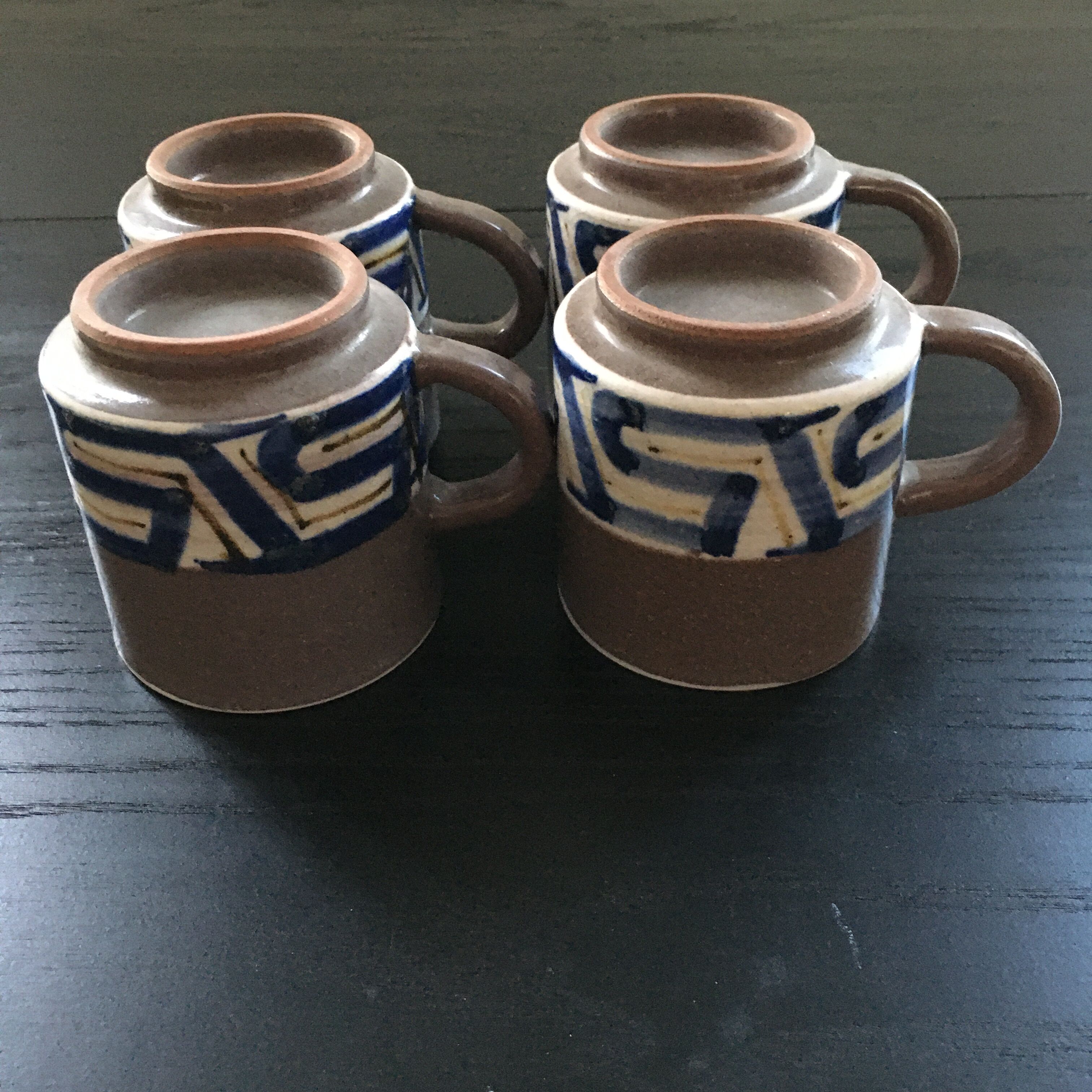 Set of 4 brown stoneware mugs and saucers with blue decor