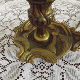 Vintage French bronze Wee Willie Winkie style lamp with red card shade.