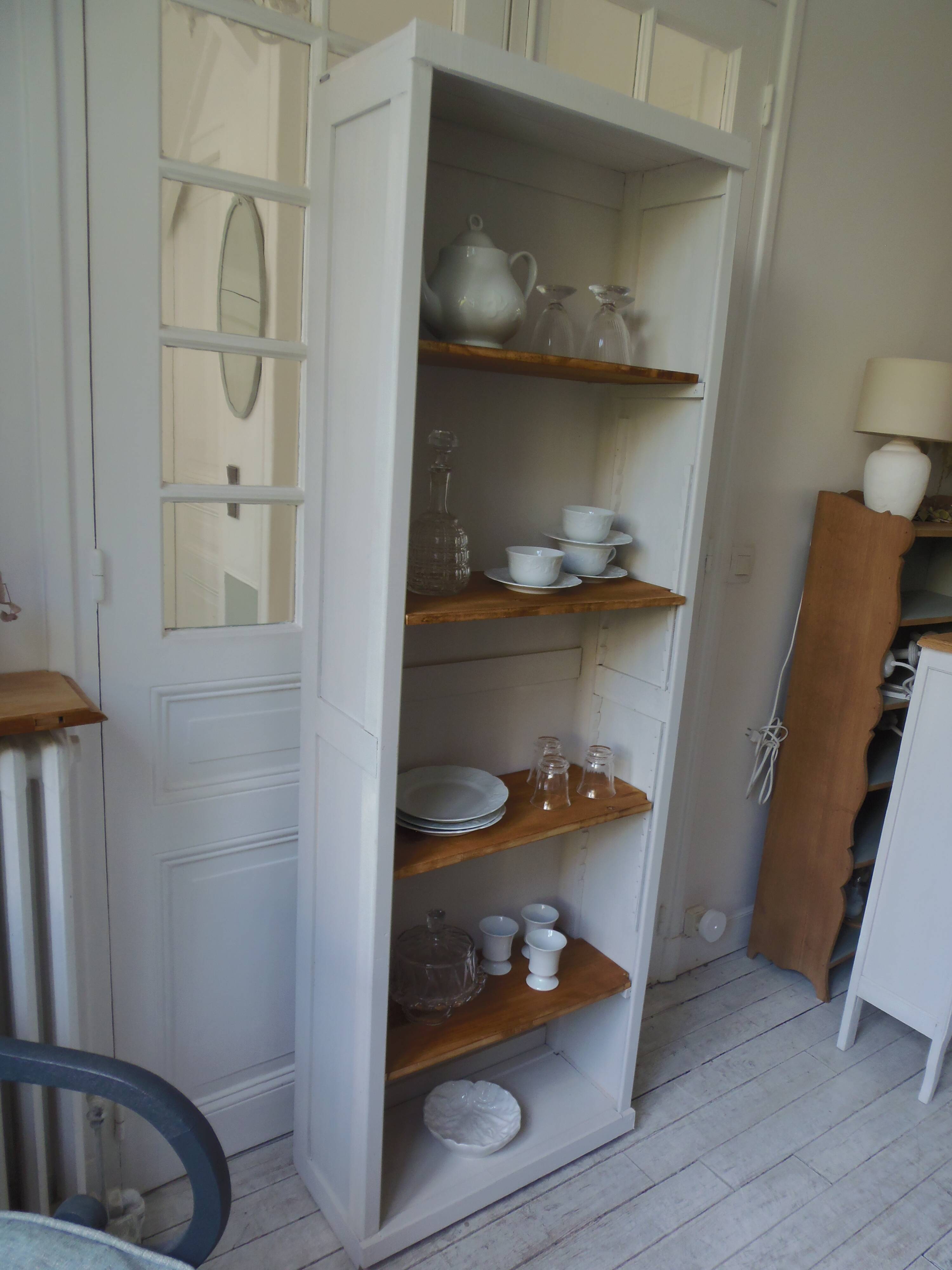 Shallow depth bookcase re-enchanted in pearl gray, wooden shelves.
