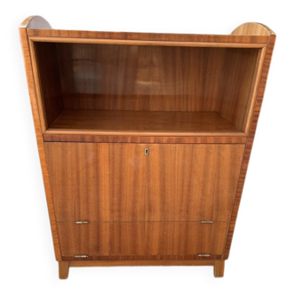 Brown trapezoidal wooden bar cabinet from the 1960s with a niche and lockable flap.
