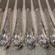 12 silver-plated dessert knives by St Medard, rocaille style, Florian.