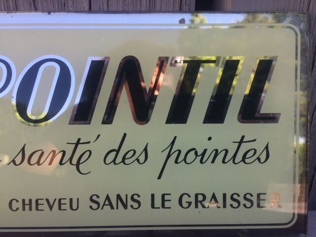 Plate fixed under advertising glass