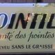 Plaque publicitaire fixé sous verre