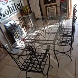 Glass table and wrought iron chairs