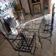 Glass table and wrought iron chairs
