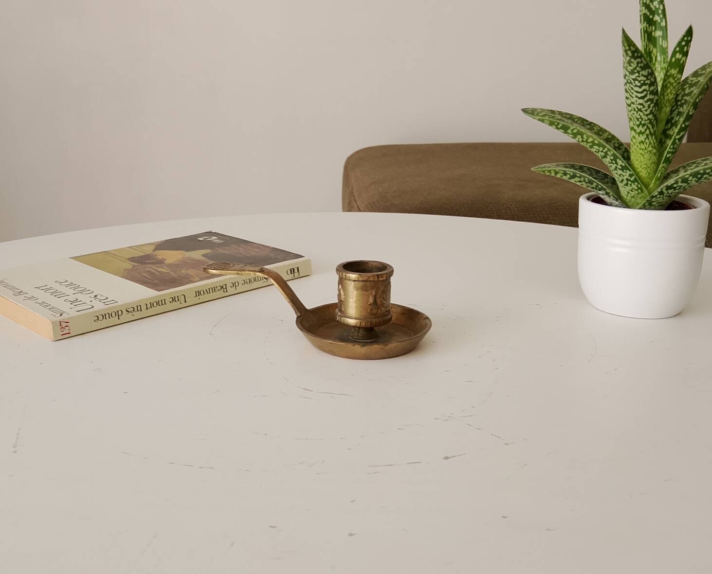 Antique hand-held candlestick in gilded bronze