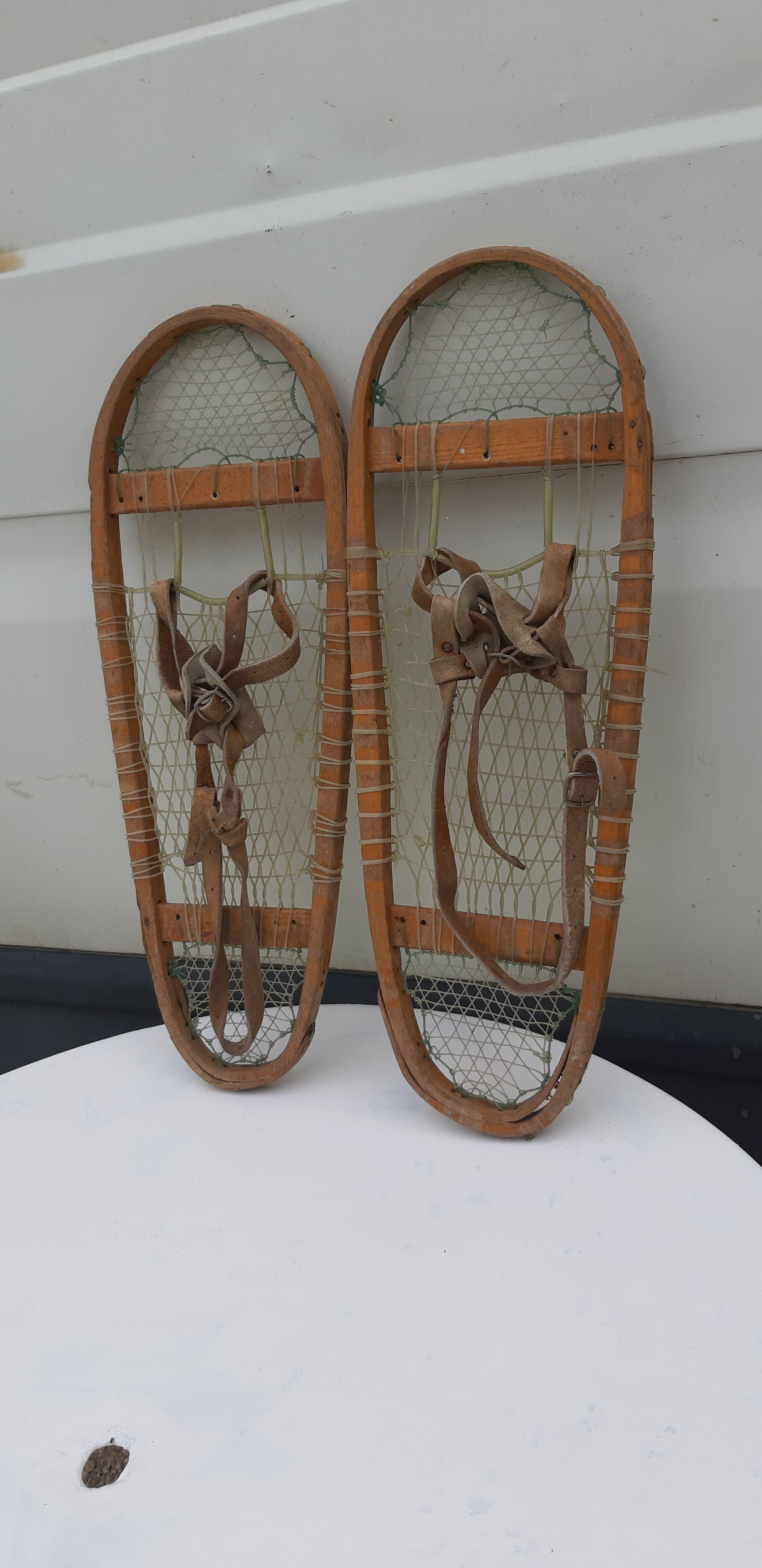 Old snowshoes made of wood and hoses